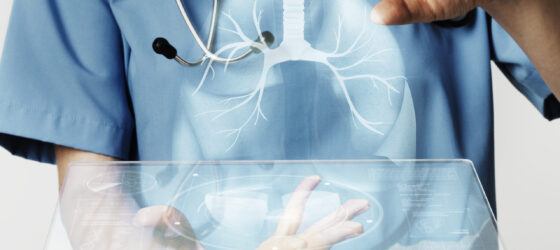 Doctors using transparent tablet with hologram medical technology